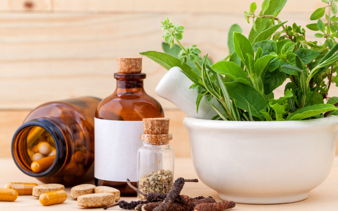 Image of herbal medicine including plants, pills, dried herbs